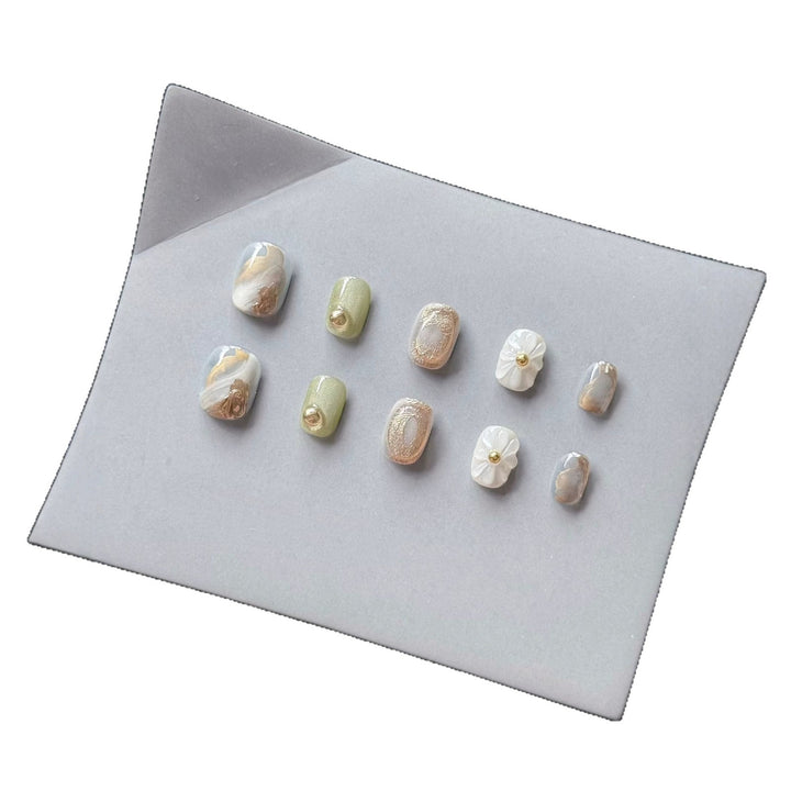 Premium Press-On Nail Art Set with Floral and Metallic Accents
