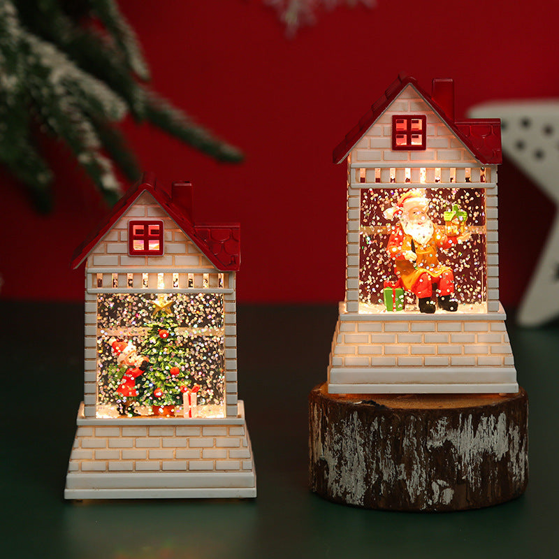 Illuminated Christmas village with moving figures Stornfield