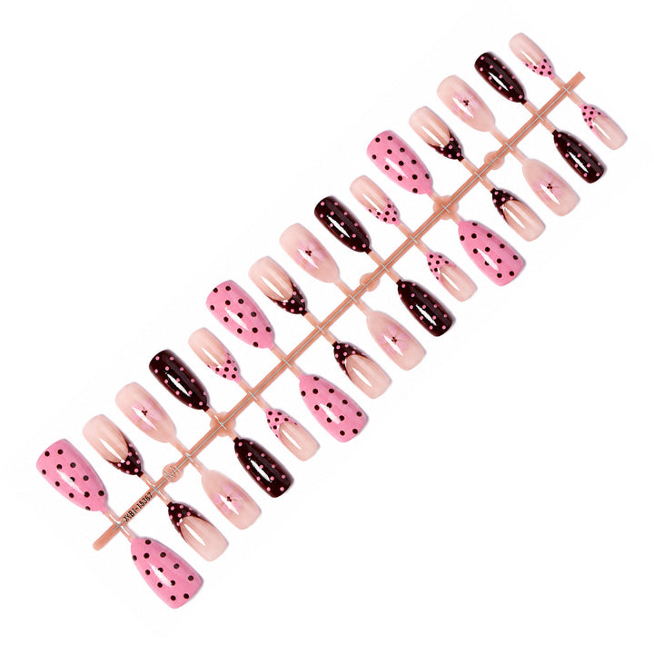 Artificial nail set with playful dots and floral accents Stornfield