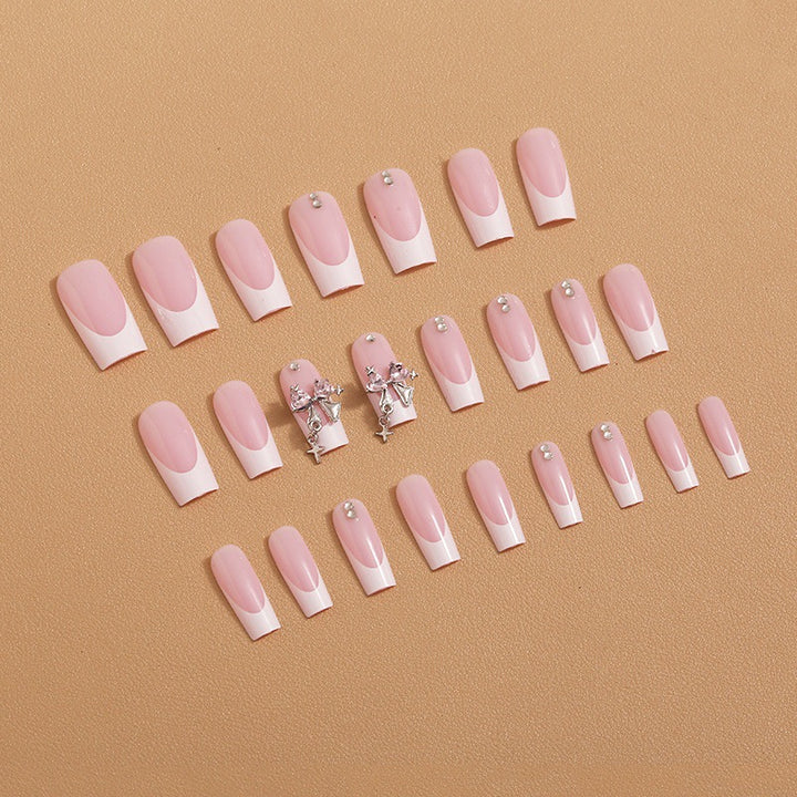 Artificial nail set with luxurious French tips and elegant embellishments Stornfield