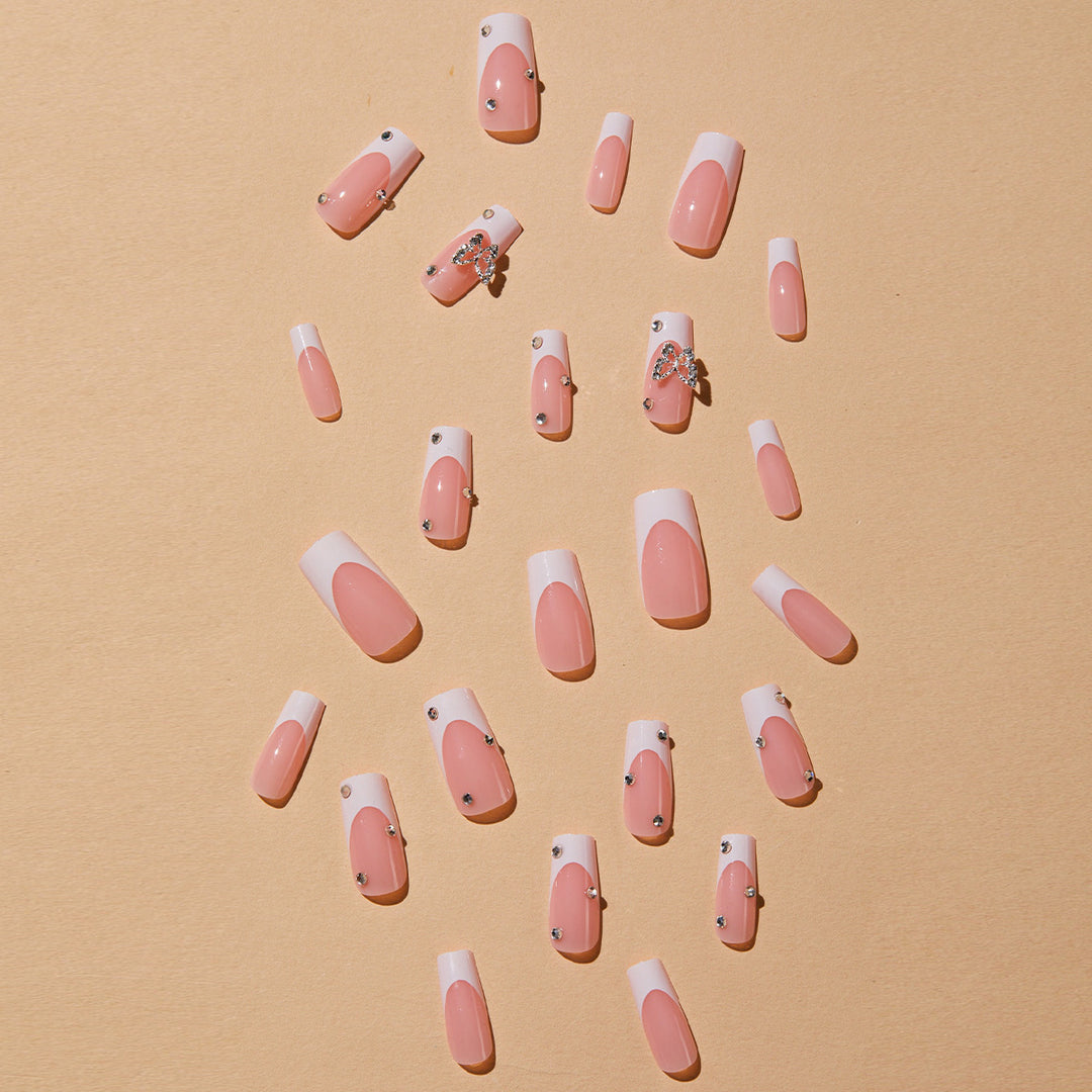 Artificial nails with elegant French tips and glitter accents Stornfield