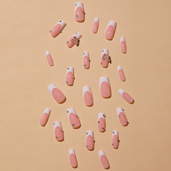 Artificial nails with elegant French tips and glitter accents Stornfield