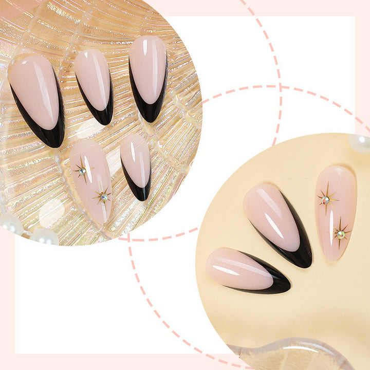 Artificial nail set with elegant black-and-white design and golden star accents Stornfield