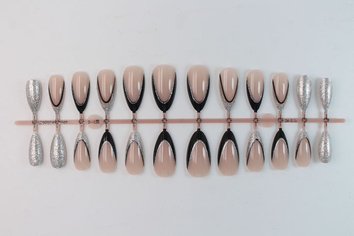 Artificial nail set with glamorous glitter accents and elegant black Stornfield