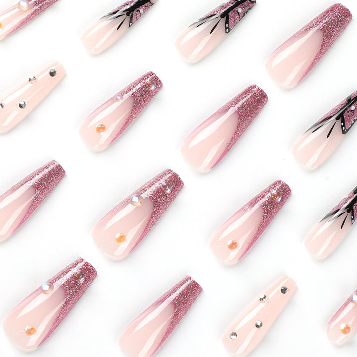 Artful stiletto nails with floral and glittering accents Stornfield