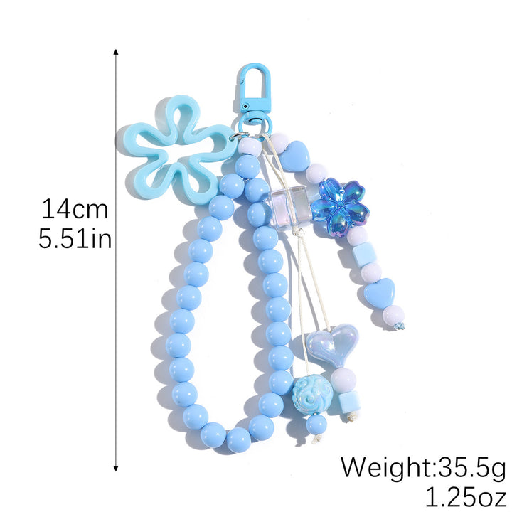 Playful keychain with flower and butterfly details Stornfield