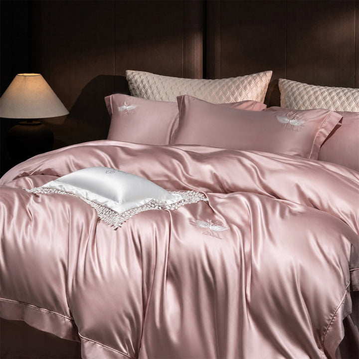 Luxurious satin bedding set with embroidered swan motif and lace pillow
