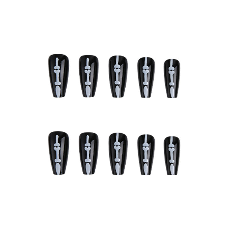 Artistic nail art with skull and bone motif Stornfield