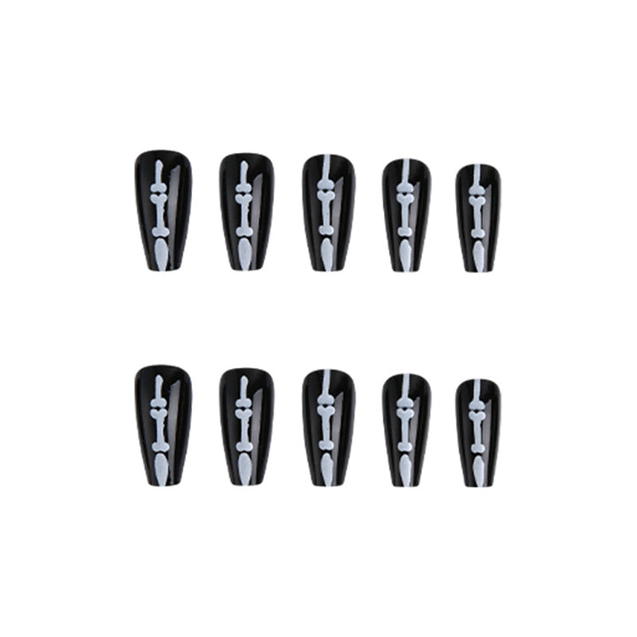 Artistic nail art with skull and bone motif Stornfield