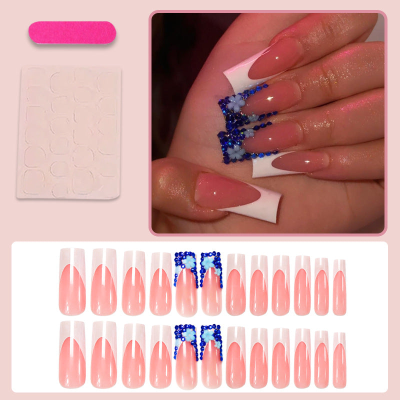 Artificial nail design with trendy blue accents and glitter coating Stornfield