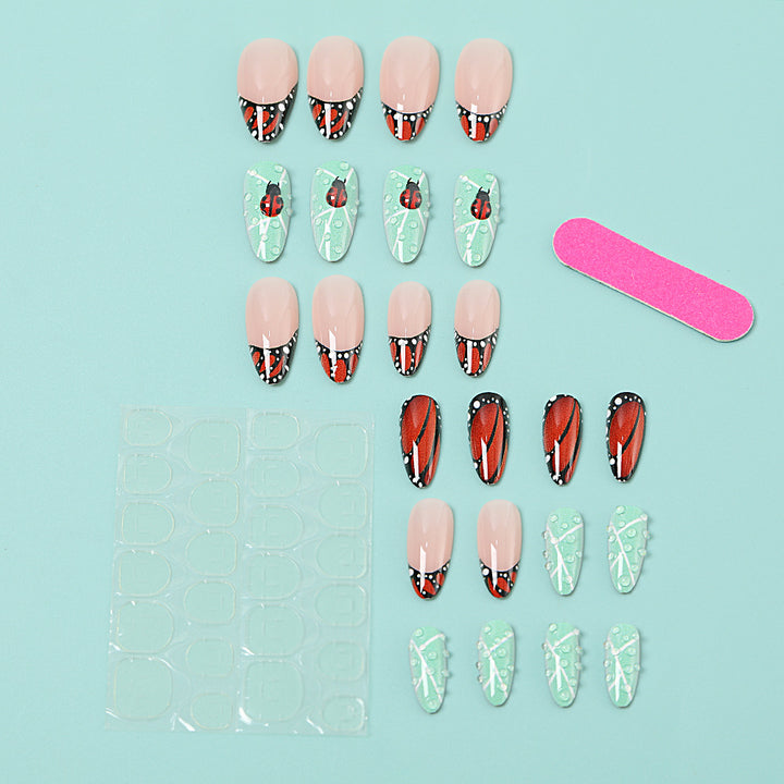 Creative nail art with elaborate butterfly and flower designs Stornfield