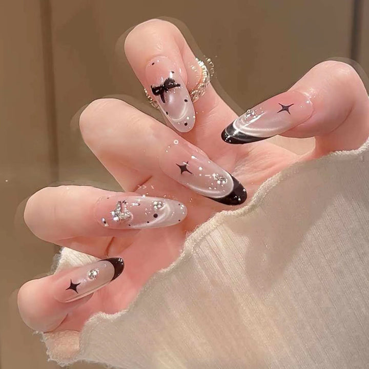 Artificial nail set with festive gift design and elegant glitter accents Stornfield