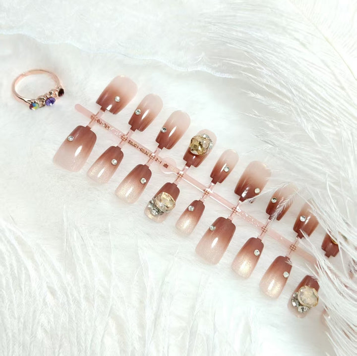 Artificials nails in elegant ombre style with rhinestone embellished applications Stornfield