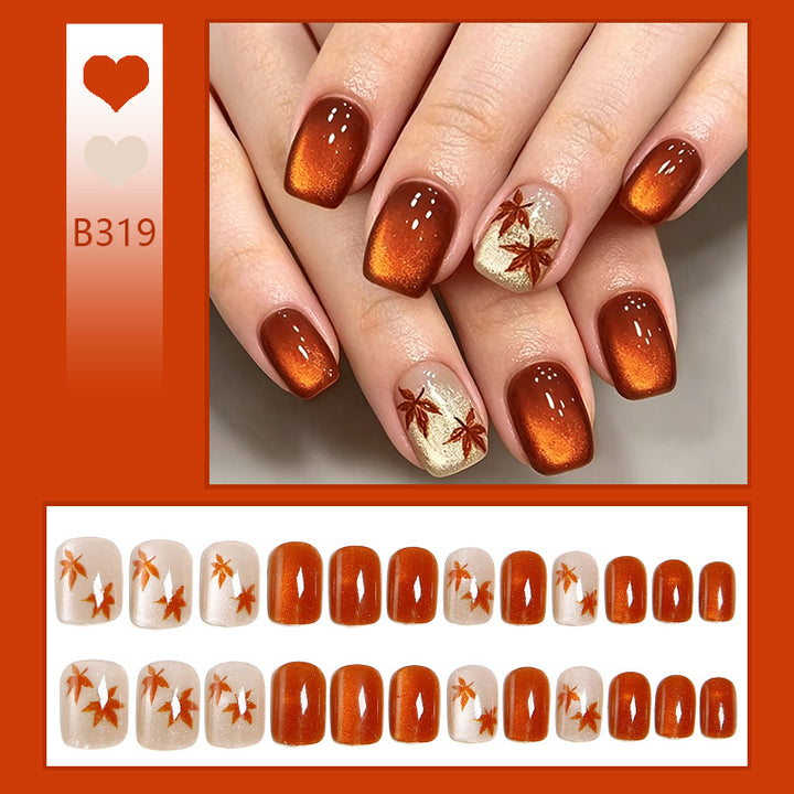 Artificial nails with glamorous ombre design and autumn leaf applications Stornfield