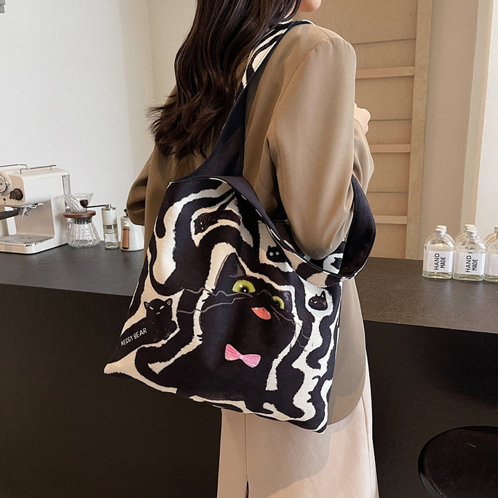 Shoulder bag with playful cat motif Stornfield