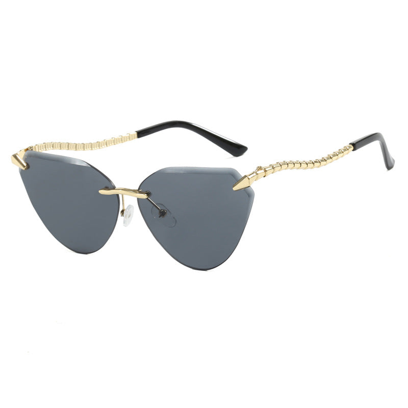 Women's Cat-Eye Sunglasses with unique gold frame design and protective lenses Stornfield