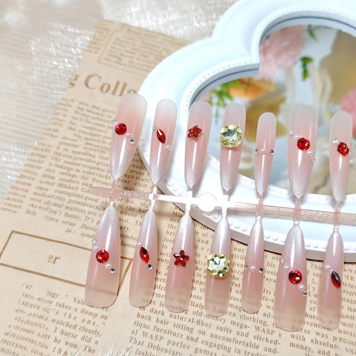 Glamorous artificial nails with shimmering embellishments Stornfield