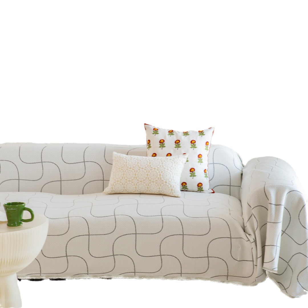 Woven sofa throw made of cotton blend with geometric pattern