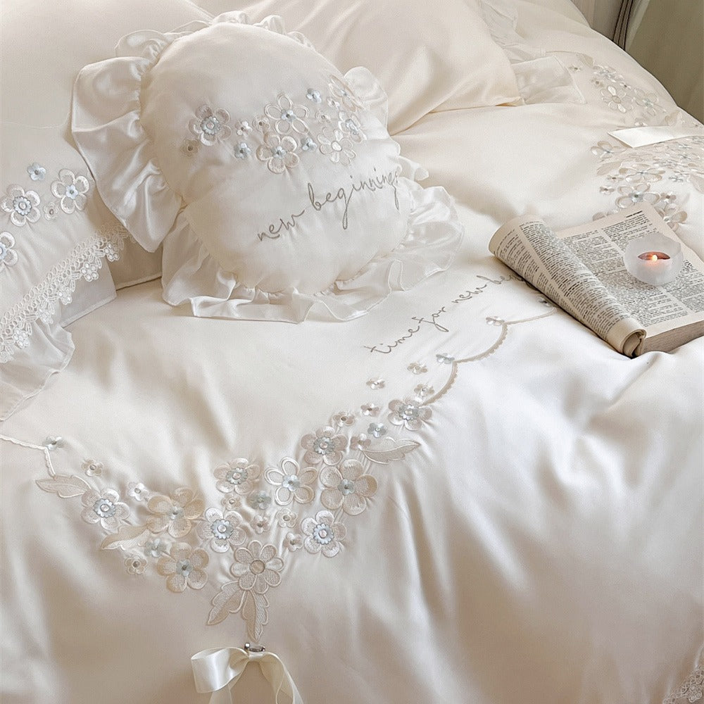 Victorian-inspired cotton satin bedding set with lace ruffles and bows