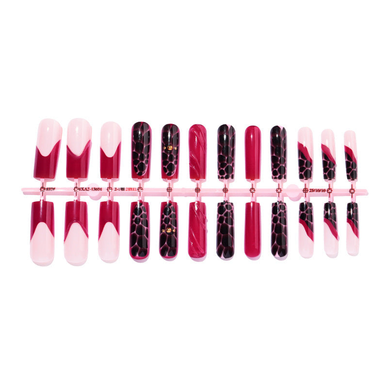 Nail set with stylish marbled designs and delicate accents Stornfield