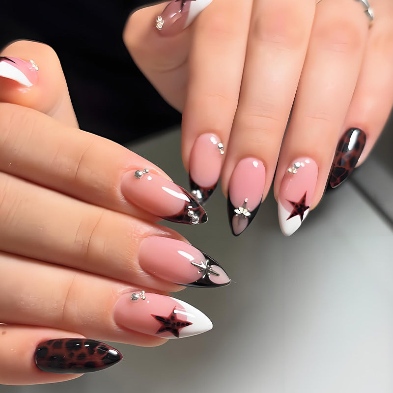 Acrylic nail set with creative star patterns and glitter accents Stornfield