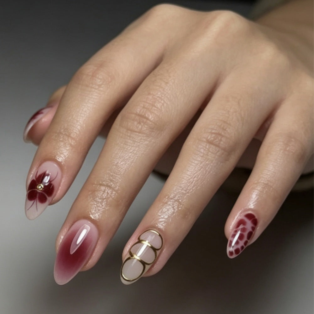Artificial nails with elaborate flower designs and elegant accents Stornfield