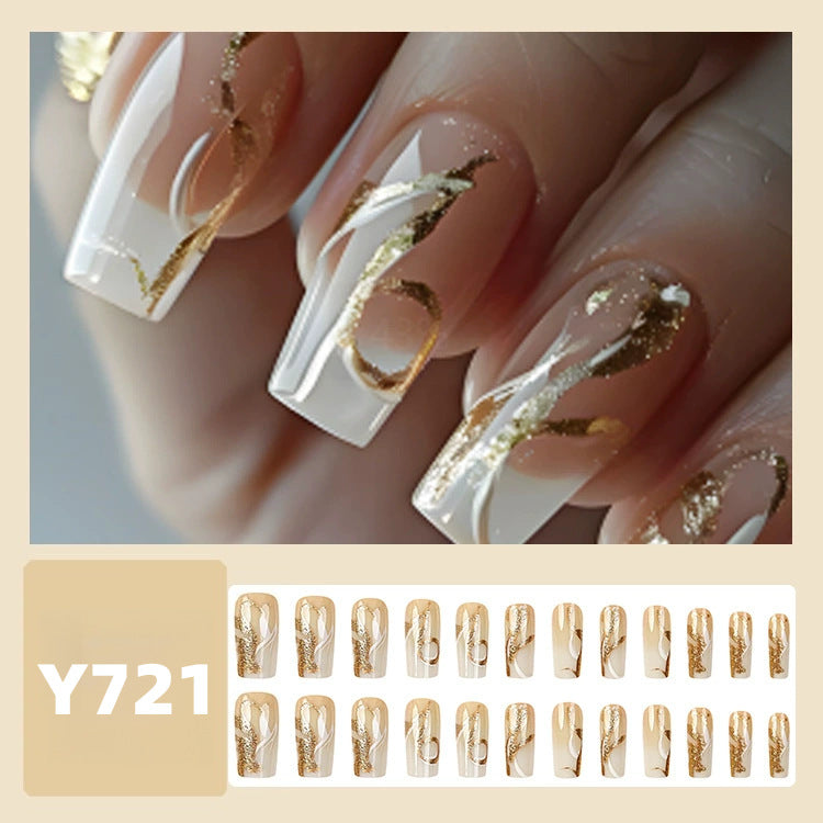 Artificial nails with elegant gold accents Stornfield