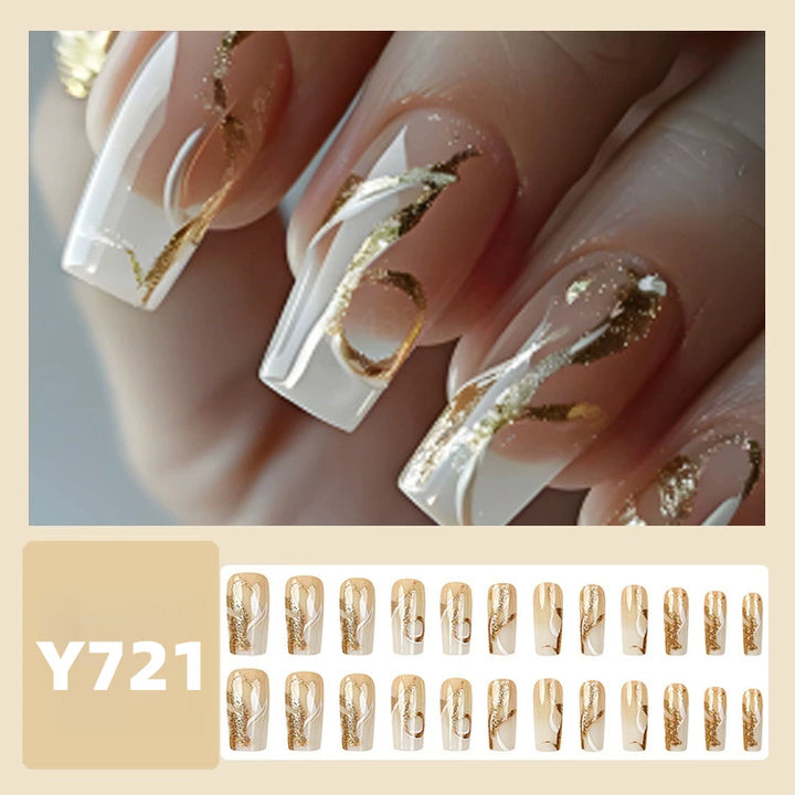 Artificial nails with elegant gold accents Stornfield