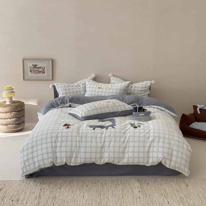 Plush bedding set with embroidered dog motif and striped cuddle blanket