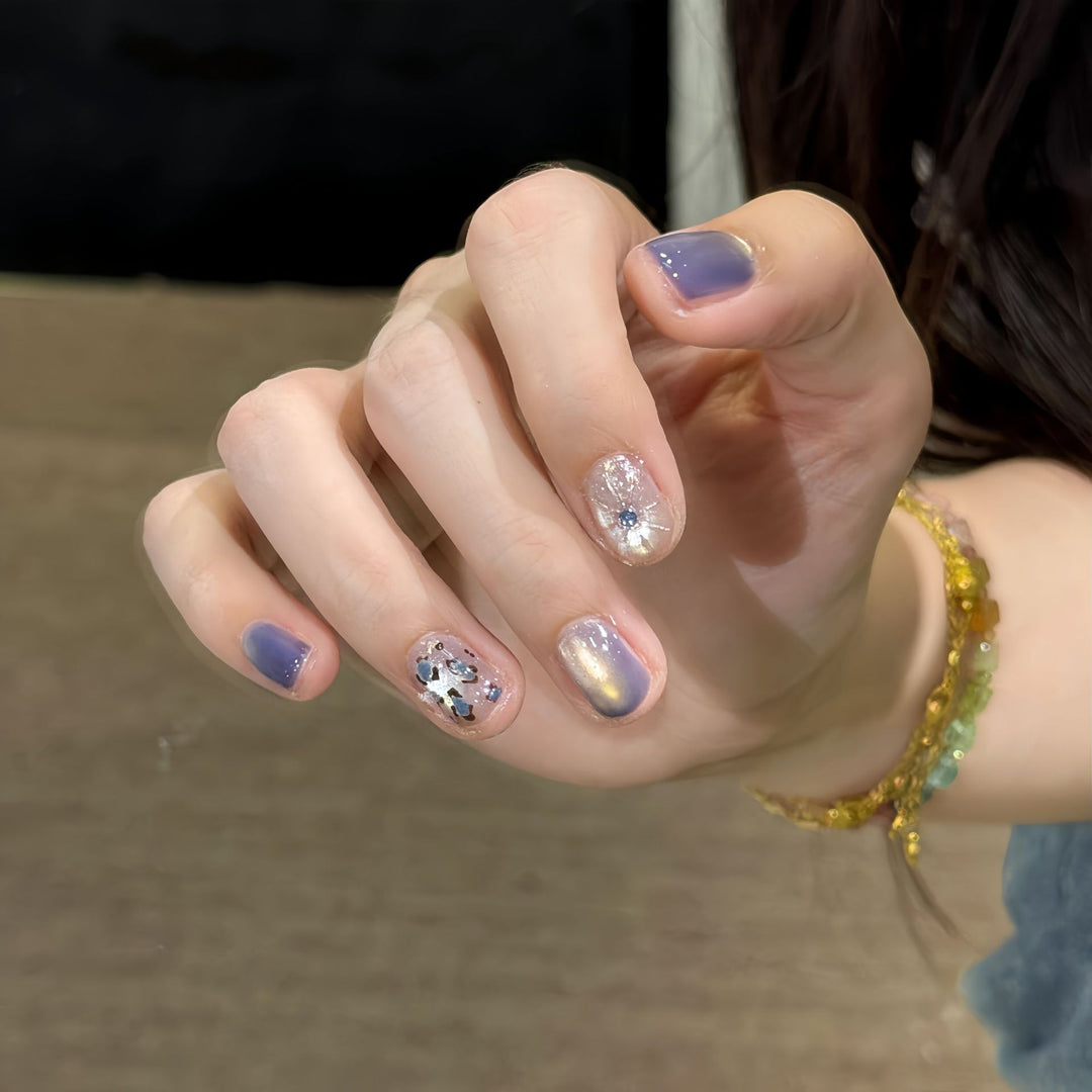 Glamorous artificial nails with elegant glitter elements Stornfield
