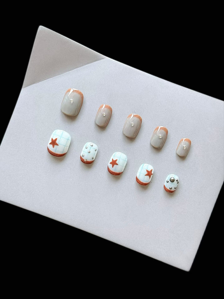 Artistic Press-On Nail Art Set with Star and Metallic Accents