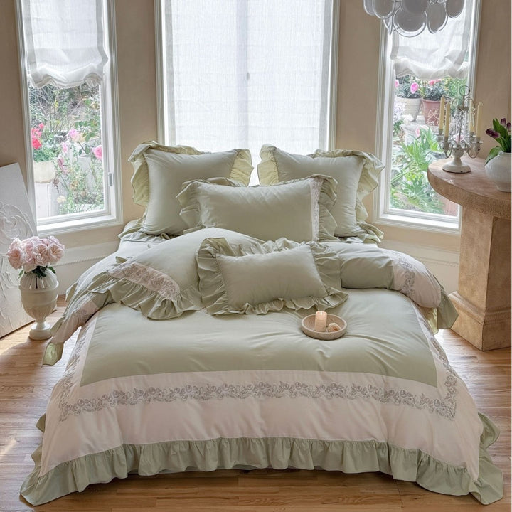 Designer bed linen set with ruffle hem and fine border embroidery