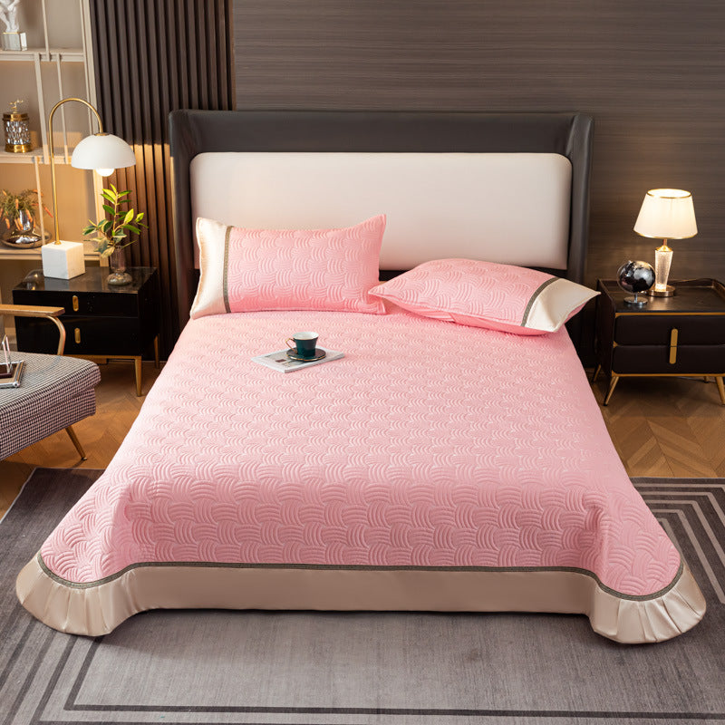 Quilted bedspread set with satin ruffle and geometric wave relief