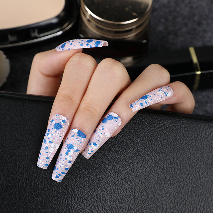 Artistic splatter design artificial nails Stornfield