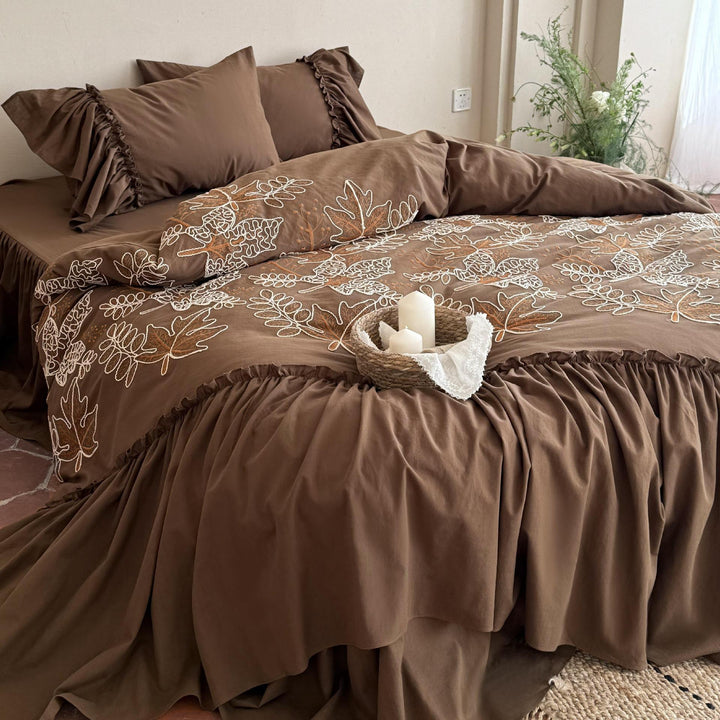 Bedding set with embroidered leaf pattern, ruffled bed skirt and ruffled pillow