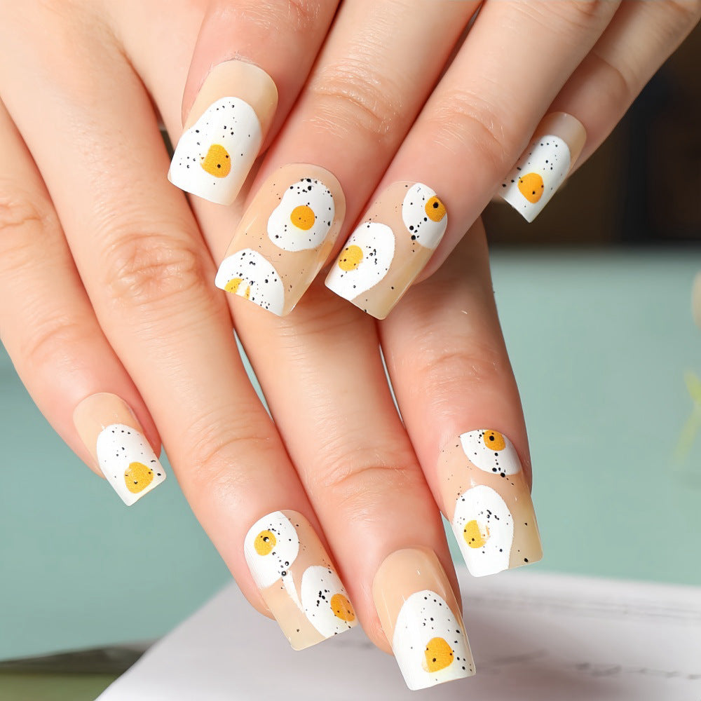 Artificial nails in creative fried egg design Stornfield