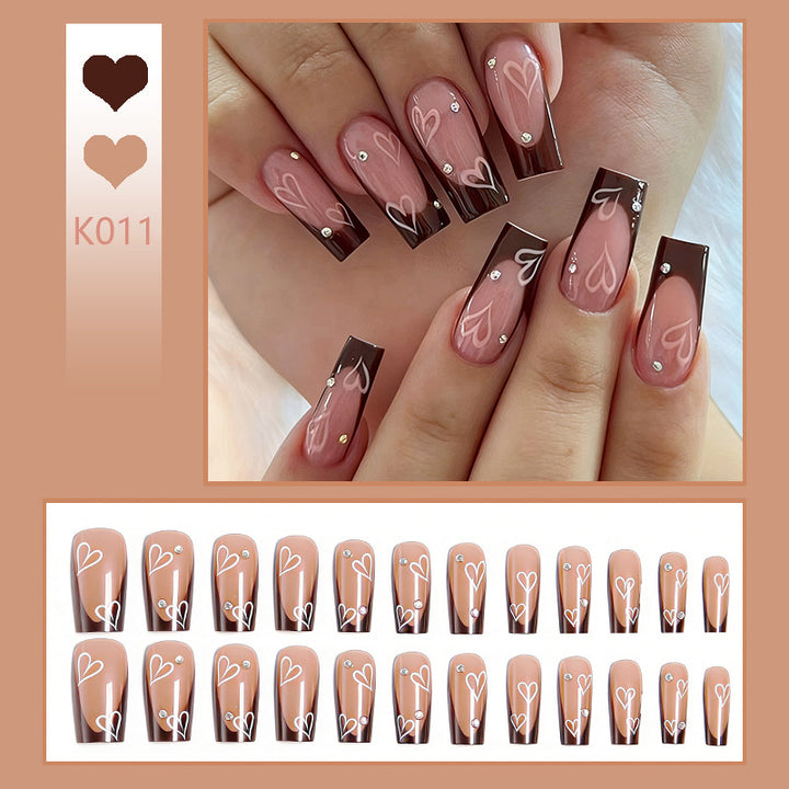 Elegant artificial nails with heart pattern and glitter accents Stornfield