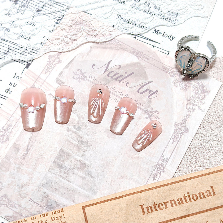 Elegant artificial nails with pearl and rhinestone embellishments Stornfield