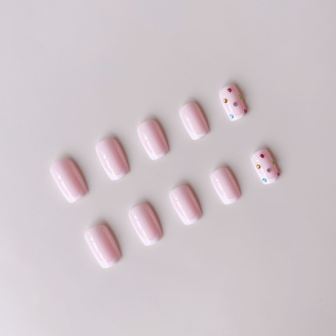 Nail art set with elegant French tips and sparkling rhinestone embellishments Stornfield