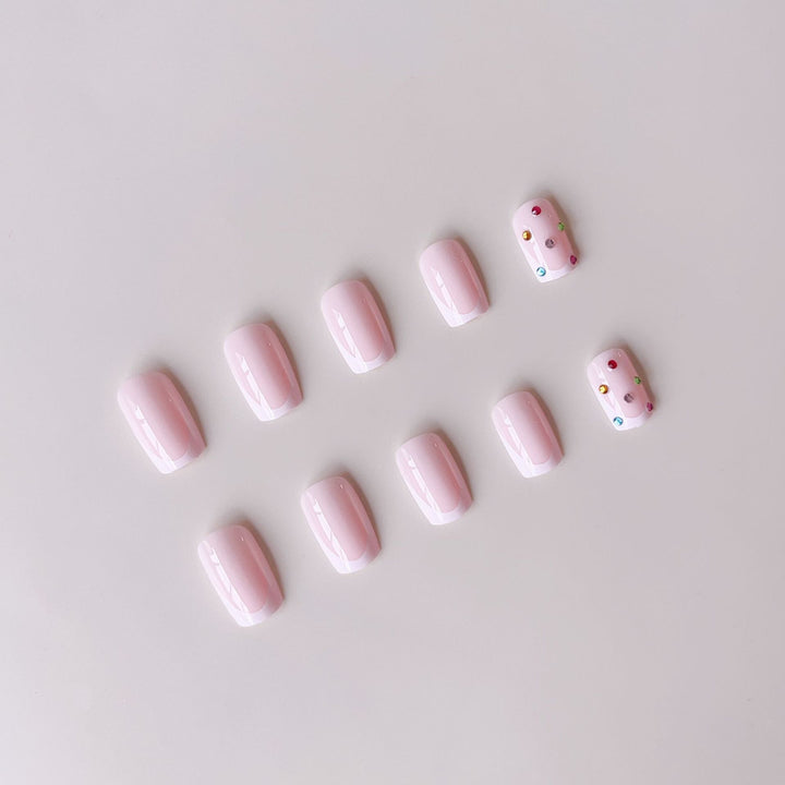 Nail art set with elegant French tips and sparkling rhinestone embellishments Stornfield