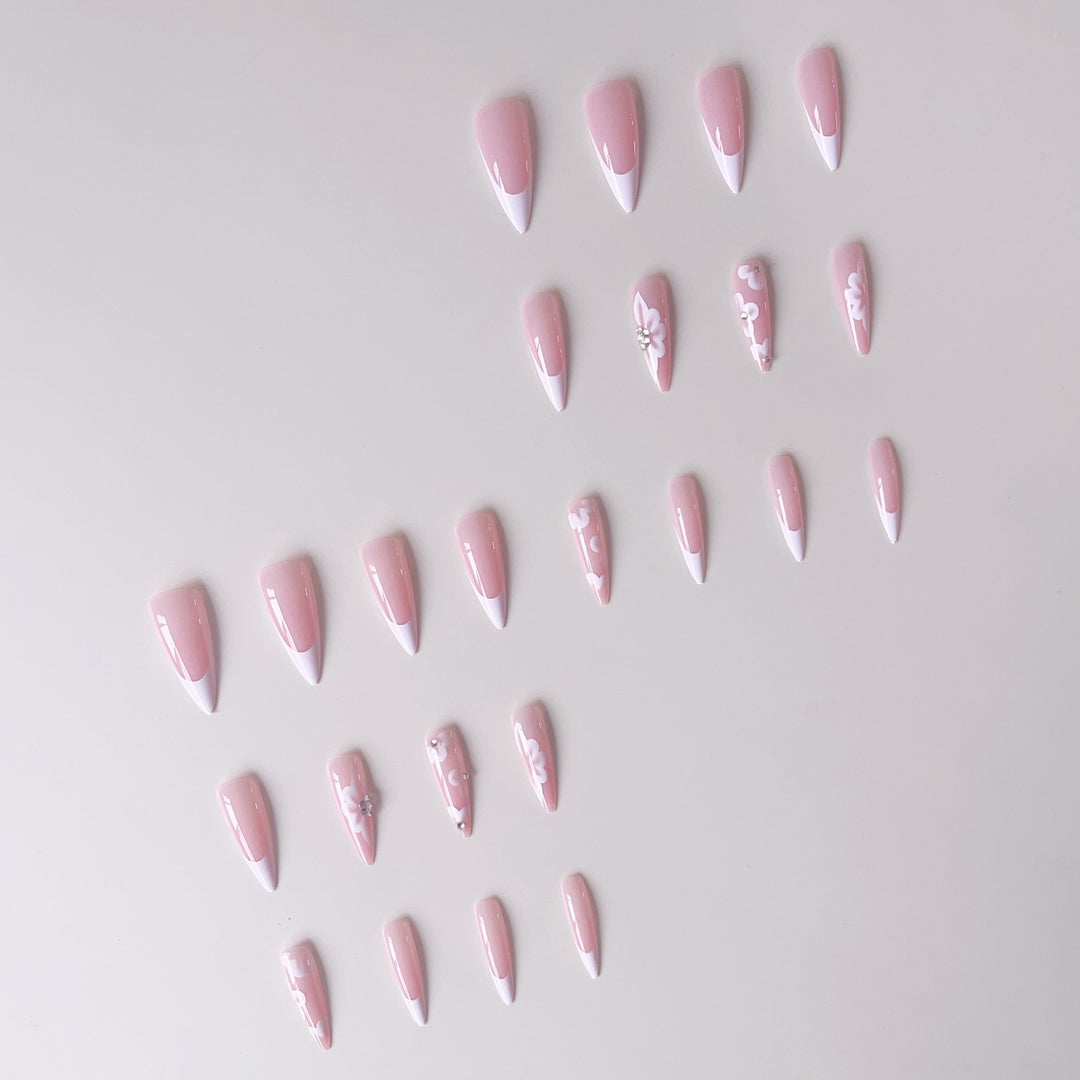 Elegant artificial nail set with floral design and glitter accents Stornfield