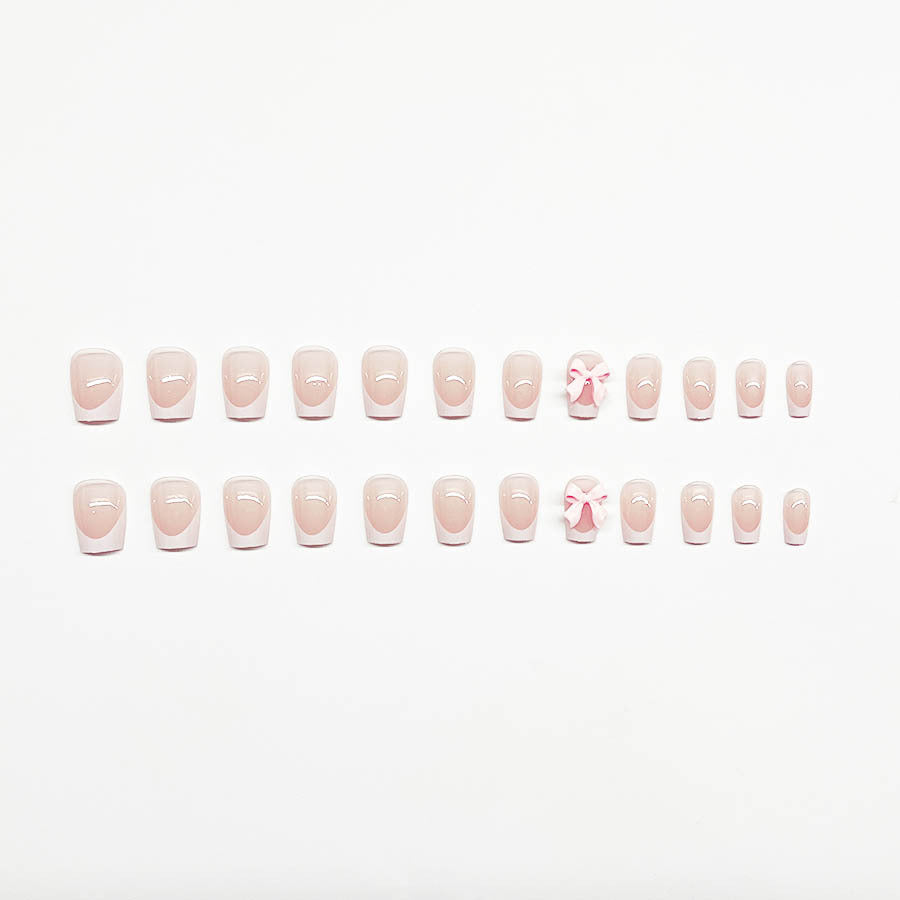 Decorative French Tip Nail Extensions with Bow Accents Stornfield