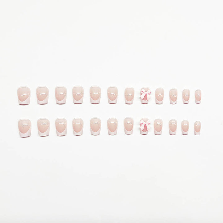 Decorative French Tip Nail Extensions with Bow Accents Stornfield