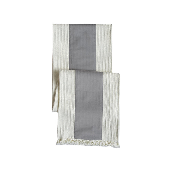 Woven table runner with contrasting center stripe, textured waffle look and decorative fringes