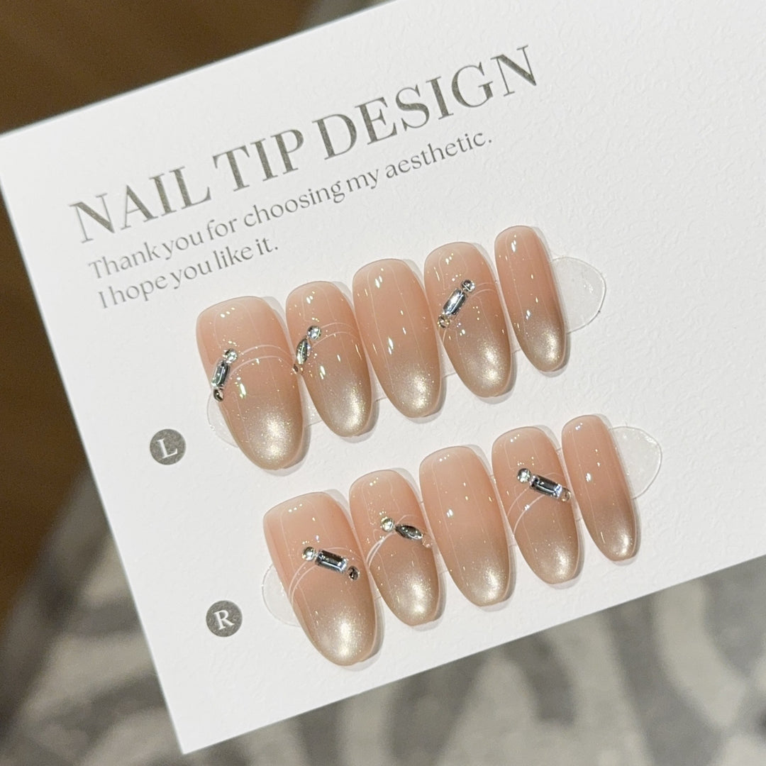 Artificial nail tips with elegant gradient color and rhinestone accents Stornfield