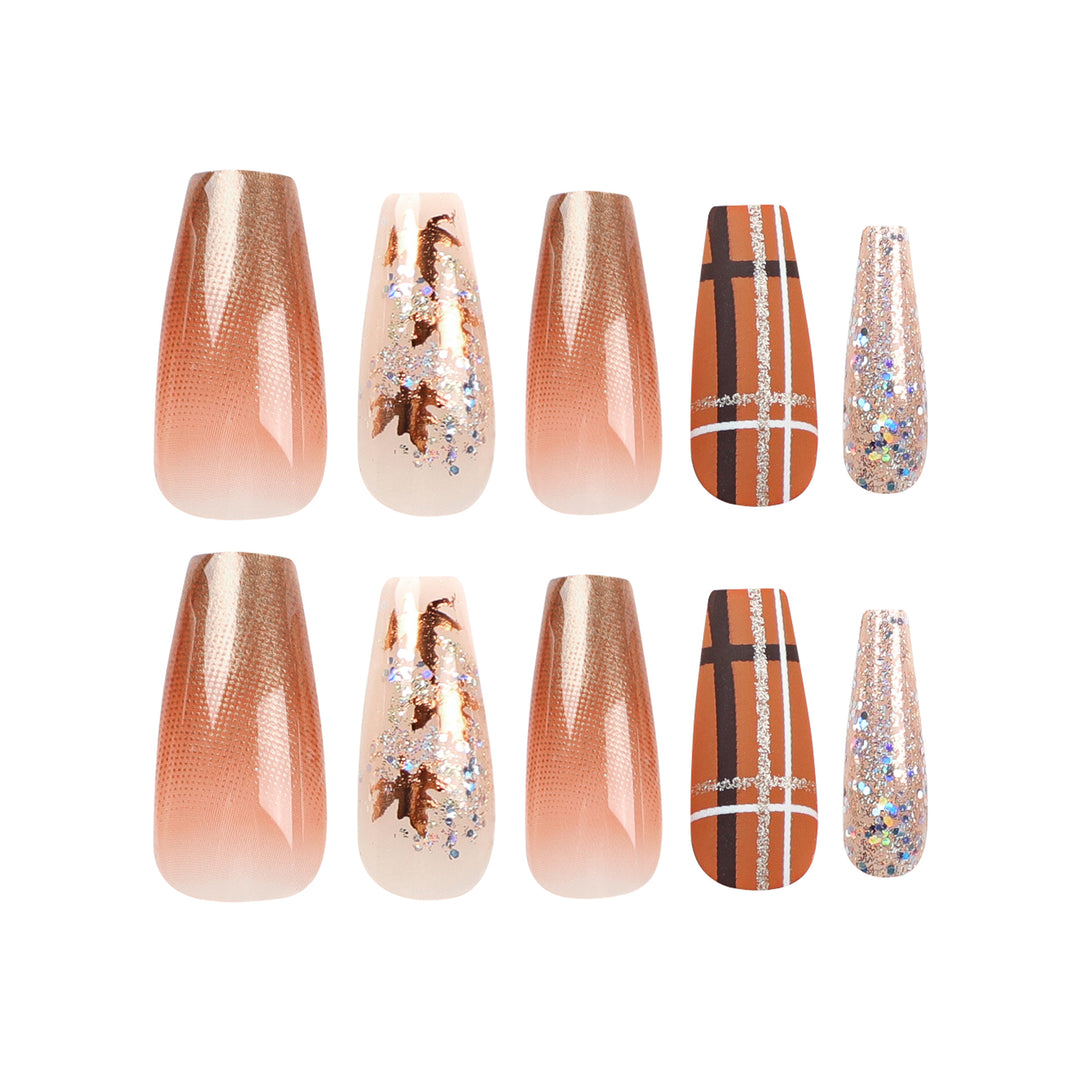 Artful nail extensions with glitter and leaf patterns Stornfield