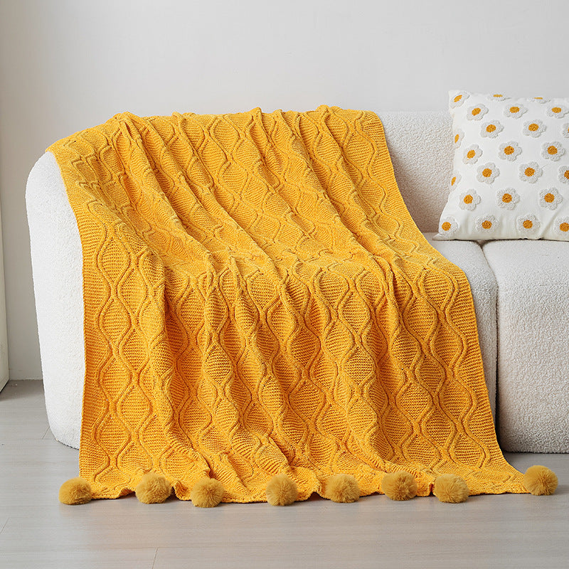 Ladies knit blanket with decorative pom poms Stornfield