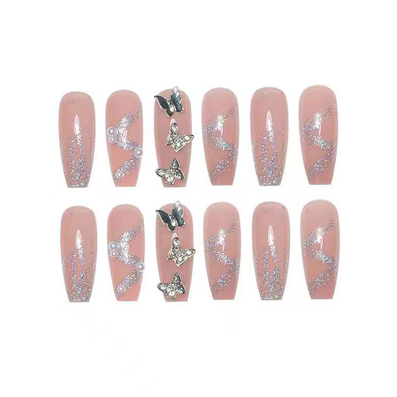 Artificial nails with sparkling rhinestone and bow accents Stornfield