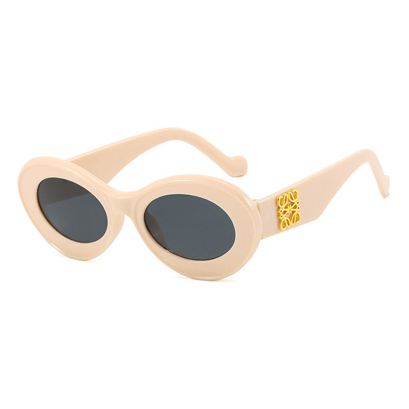 Women's fashionable sunglasses with oval frame and golden accents Stornfield
