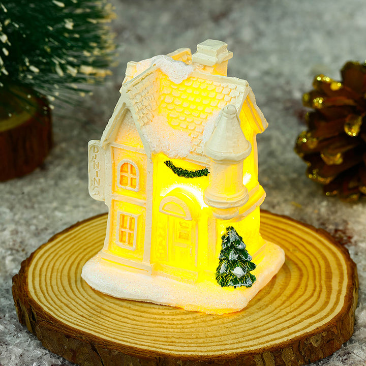 Illuminated Christmas village house with festive decoration Stornfield